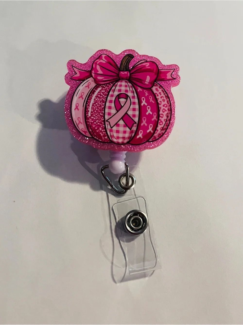 Pink Breast Cancer Awareness Pumpkin Badge Reel with Ribbon Design